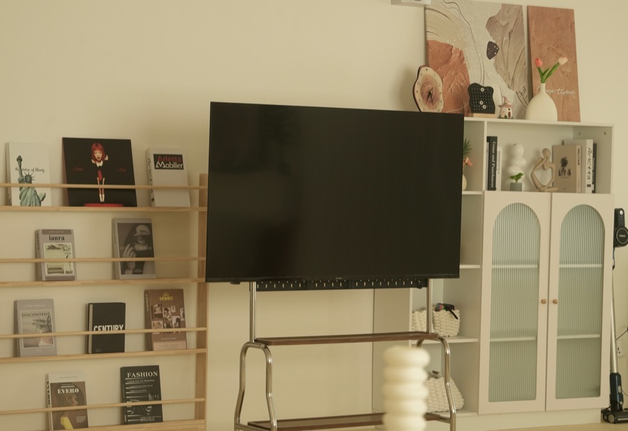 Magazine rack, TV on a rolling stand and arched cabinet